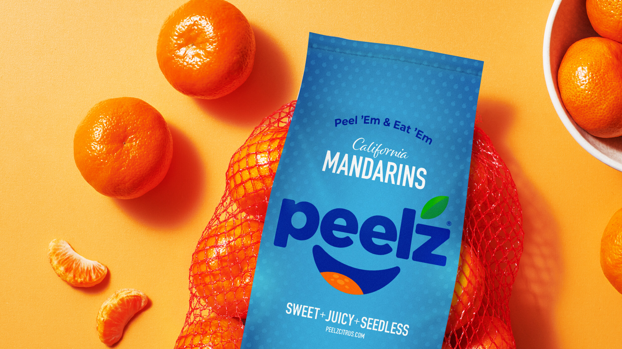 A pack of Peelz mandarin oranges sitting on a orange backdrop